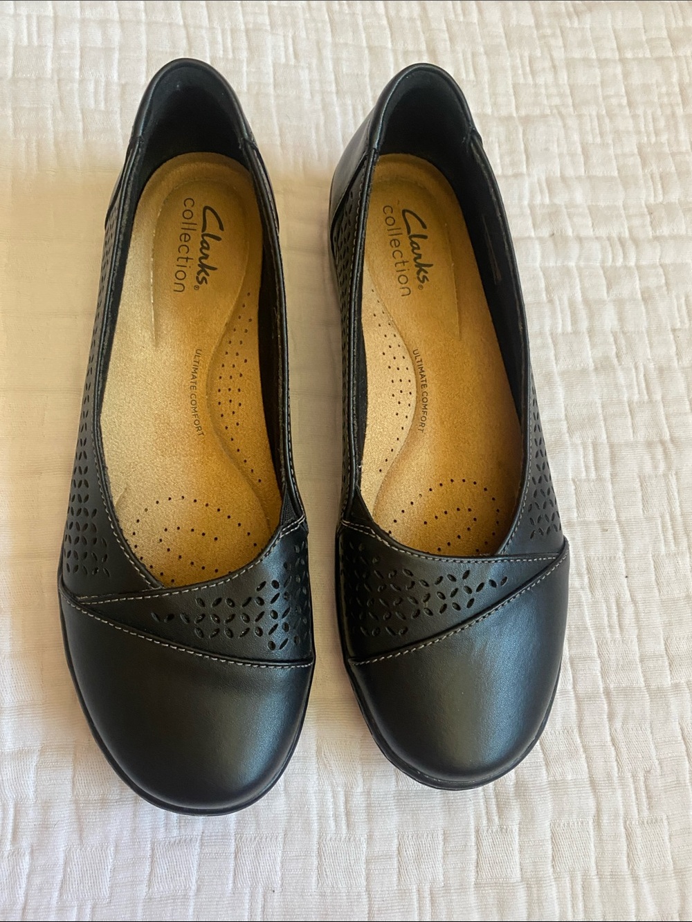 Clarks Black Perforated Leather Slip-On Flats with Tan Insole